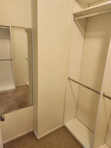 a view of a swimming pool with tables and chairs