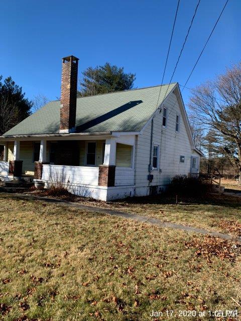 611 Fairgrounds Road Gilbert, PA 18331 - Photo 1 of 10 a front view of a house with a yard