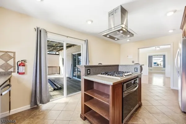 a kitchen that has a stove and a table
