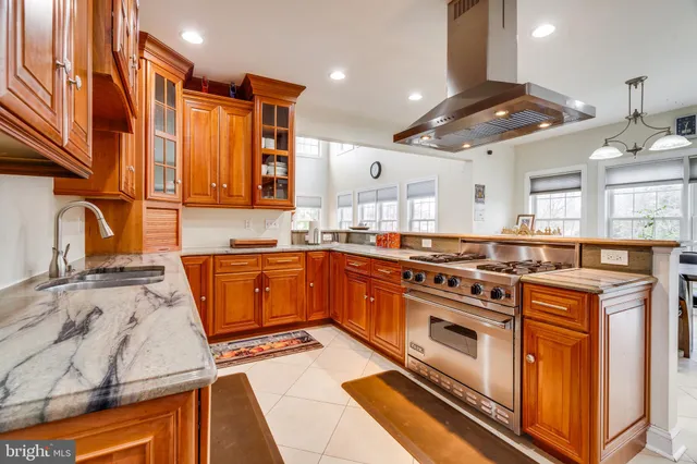 a kitchen with a stove a sink and a refrigerator