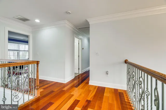 a view of an empty room with window and fire place