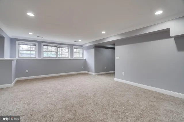 a bathroom with a sink toilet and a mirror