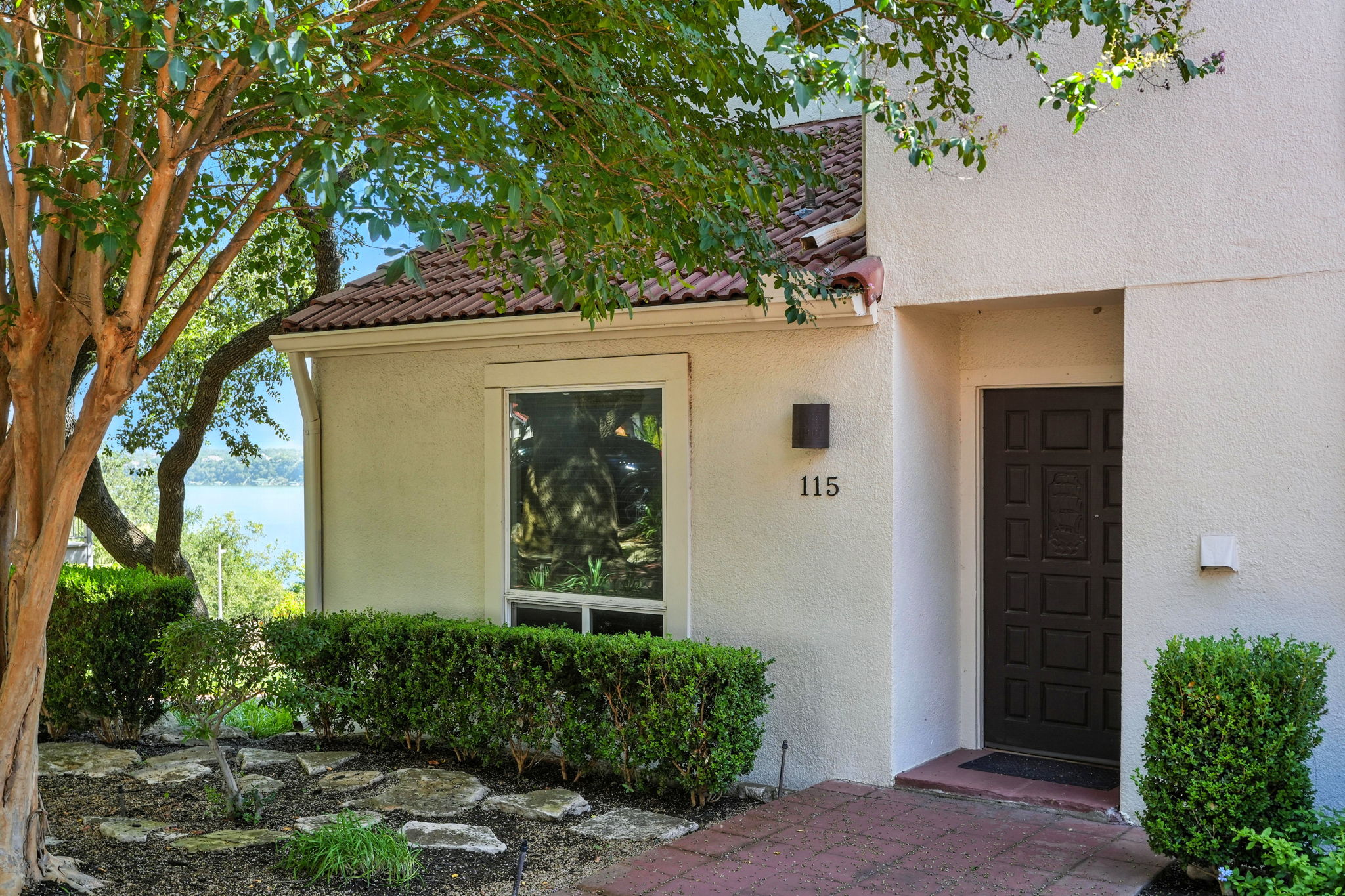 2918 Ranch Road 620 North, Unit C115 Austin, TX 78734 - Photo 3 of 39 Entrance to property featuring stucco siding and a tile roof