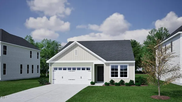 a view of house with yard and green space