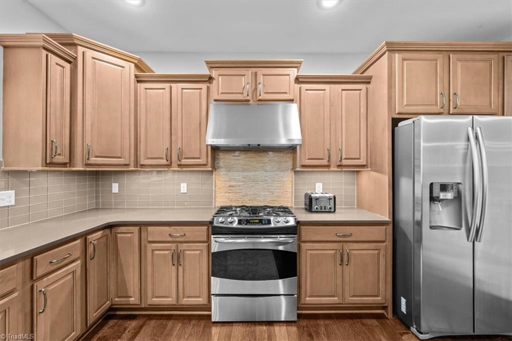 7355 Pisgah Covered Bridge Road, Unit 1 Troy, NC 27371 - Photo 14 of 50 Gas range and plenty of quartz counterspace