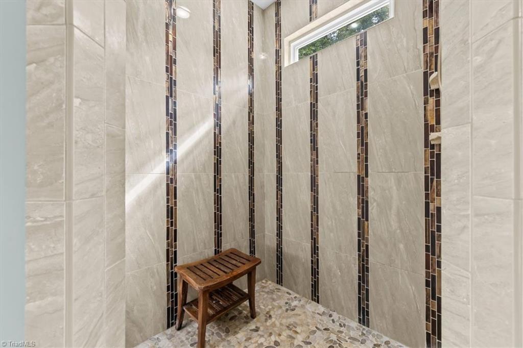 7355 Pisgah Covered Bridge Road, Unit 1 Troy, NC 27371 - Photo 21 of 50 Primary en suite with custom shower