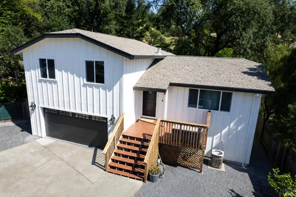 a front view of a house with garage