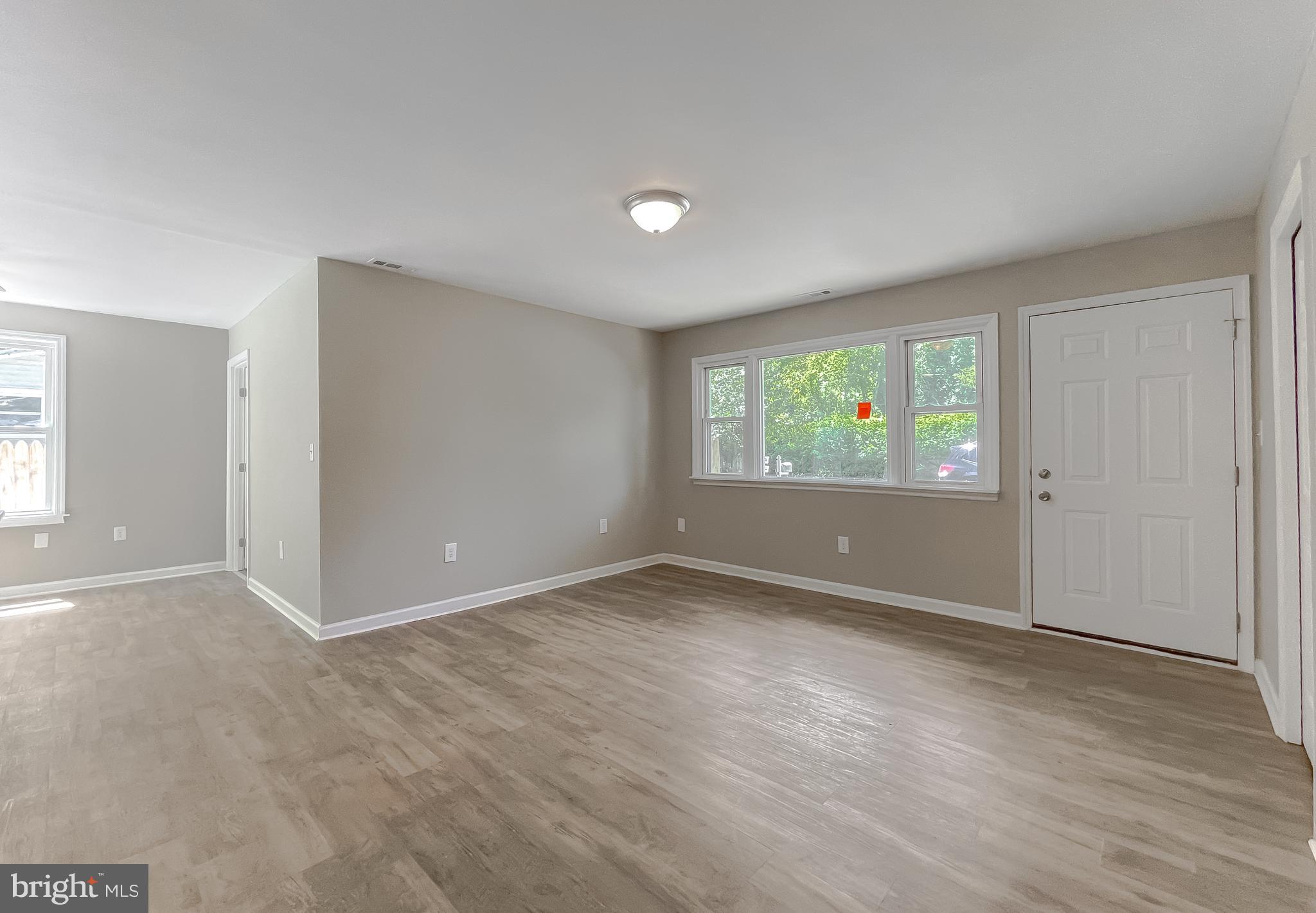 1607 Beech Road St. Leonard, MD 20685 - Photo 11 of 33 an empty room with windows