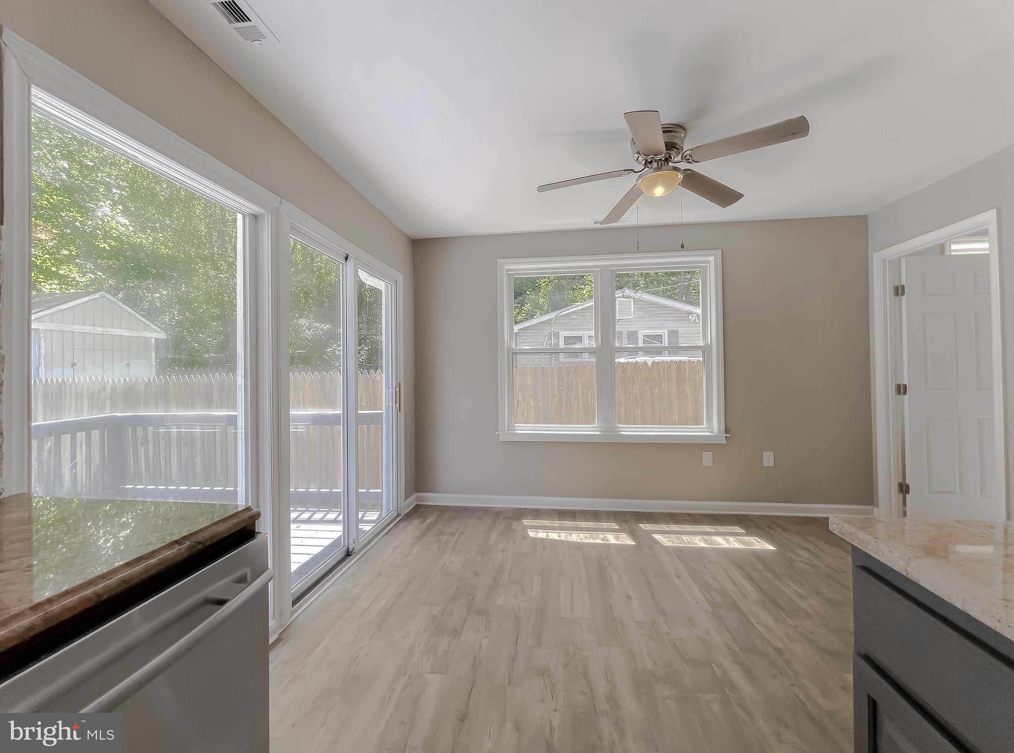 1607 Beech Road St. Leonard, MD 20685 - Photo 16 of 33 an empty room with wooden floor and windows