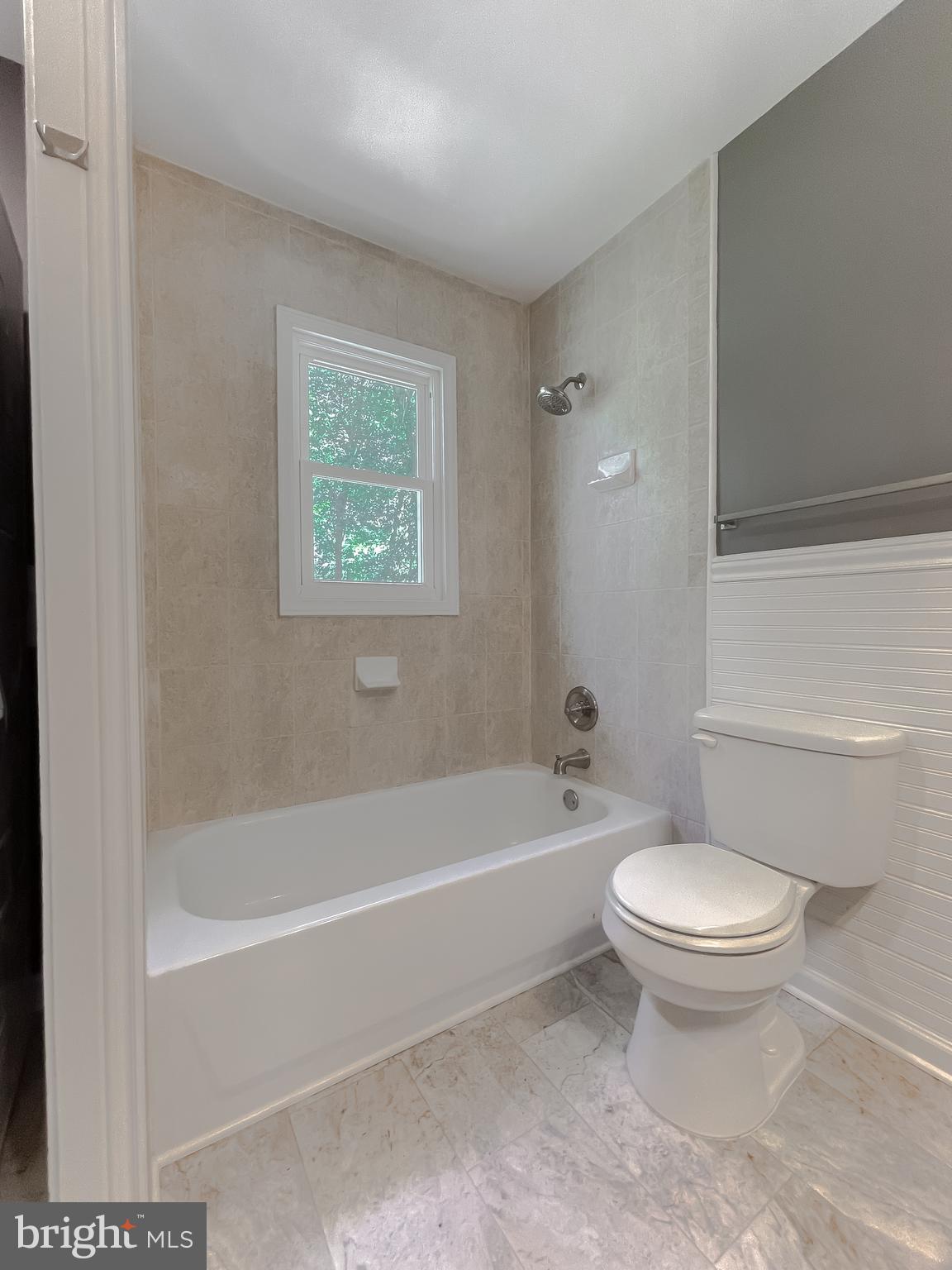 1607 Beech Road St. Leonard, MD 20685 - Photo 27 of 33 a white toilet sitting next to a bath tub