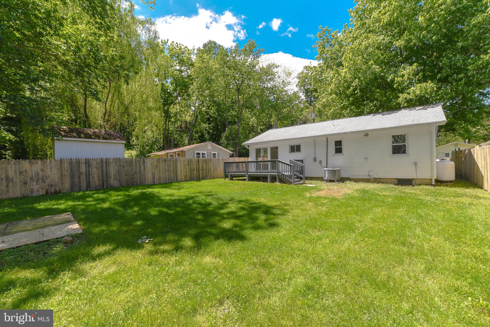 1607 Beech Road St. Leonard, MD 20685 - Photo 3 of 33 a view of house with backyard and garden