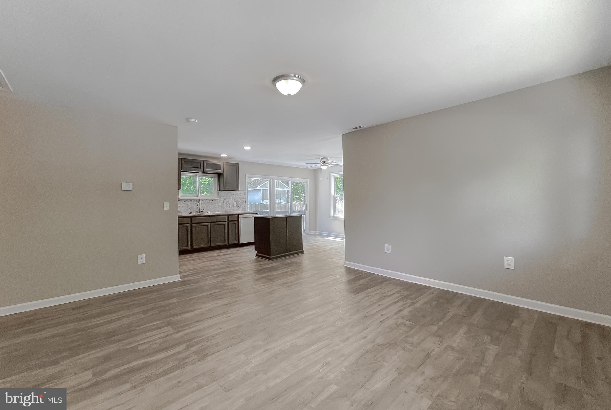 1607 Beech Road St. Leonard, MD 20685 - Photo 9 of 33 a view of kitchen and hall with wooden floor