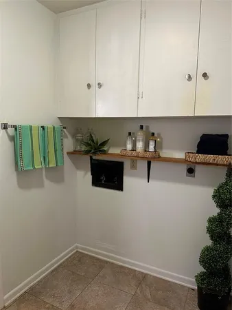 a kitchen with a cabinets and white appliances