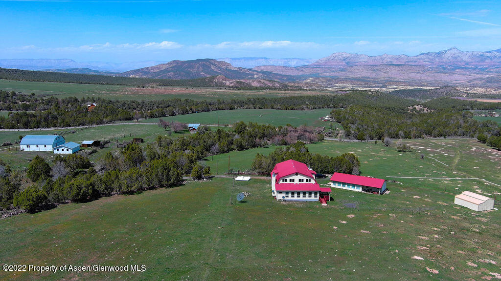 47417 KE Road Mesa, CO 81643 - Photo 16 of 40 a view of a lush green hillside and a houses