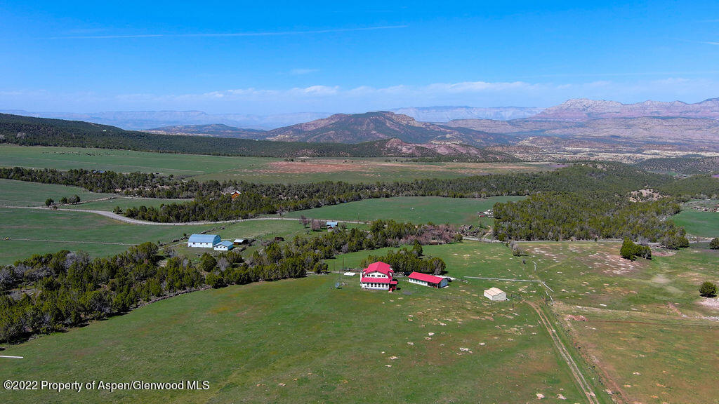 47417 KE Road Mesa, CO 81643 - Photo 26 of 40 a view of a lush green hillside and a houses
