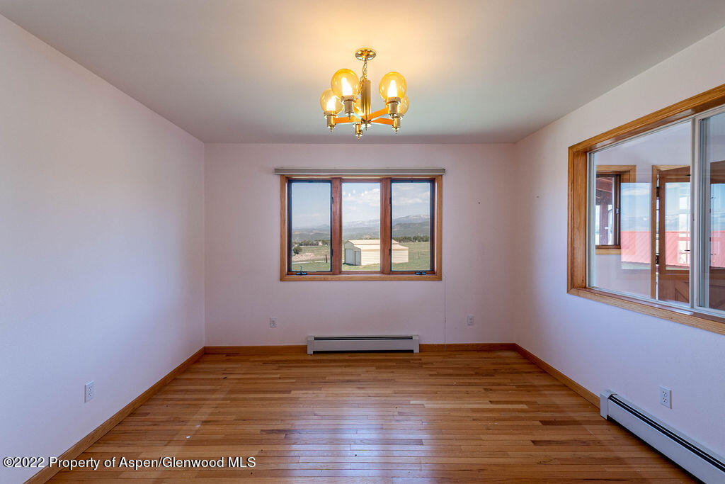 47417 KE Road Mesa, CO 81643 - Photo 4 of 40 a view of empty room with wooden floor and fan
