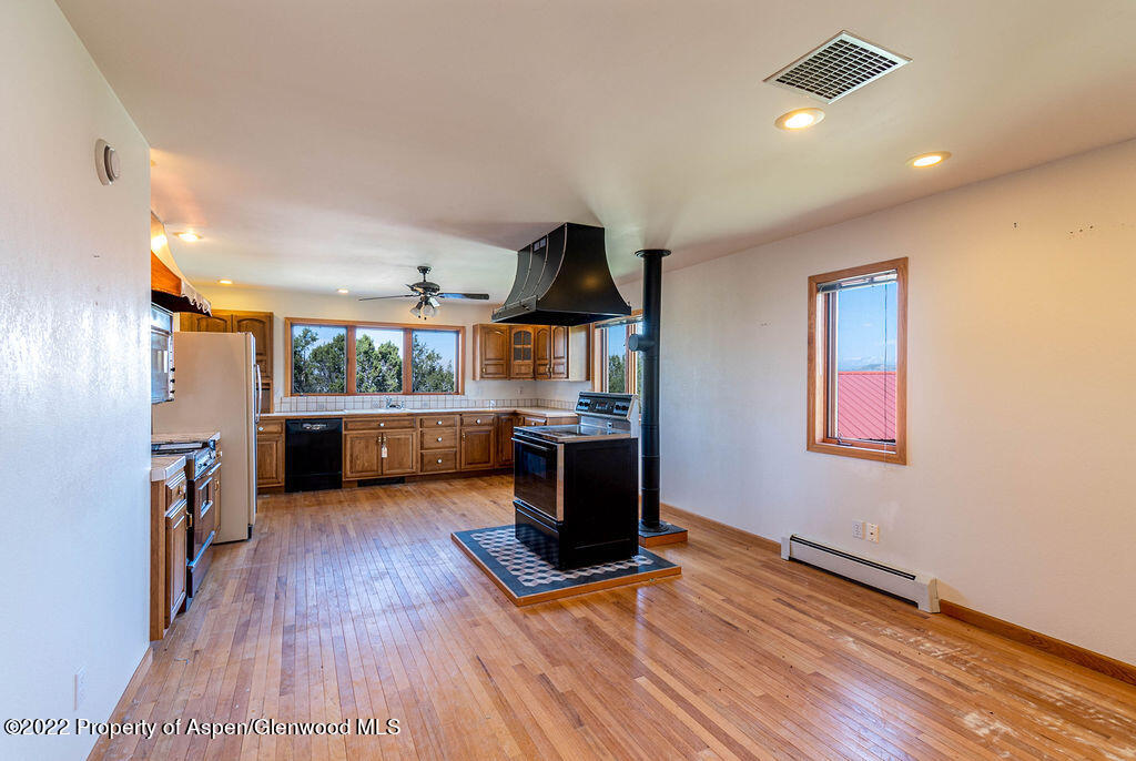 47417 KE Road Mesa, CO 81643 - Photo 5 of 40 a living room with furniture and a wooden floor