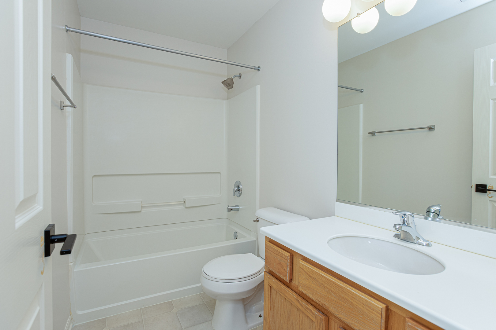 720 Thornbury Road Bartlett, IL 60103 - Photo 13 of 24 a bathroom with a sink a toilet and shower