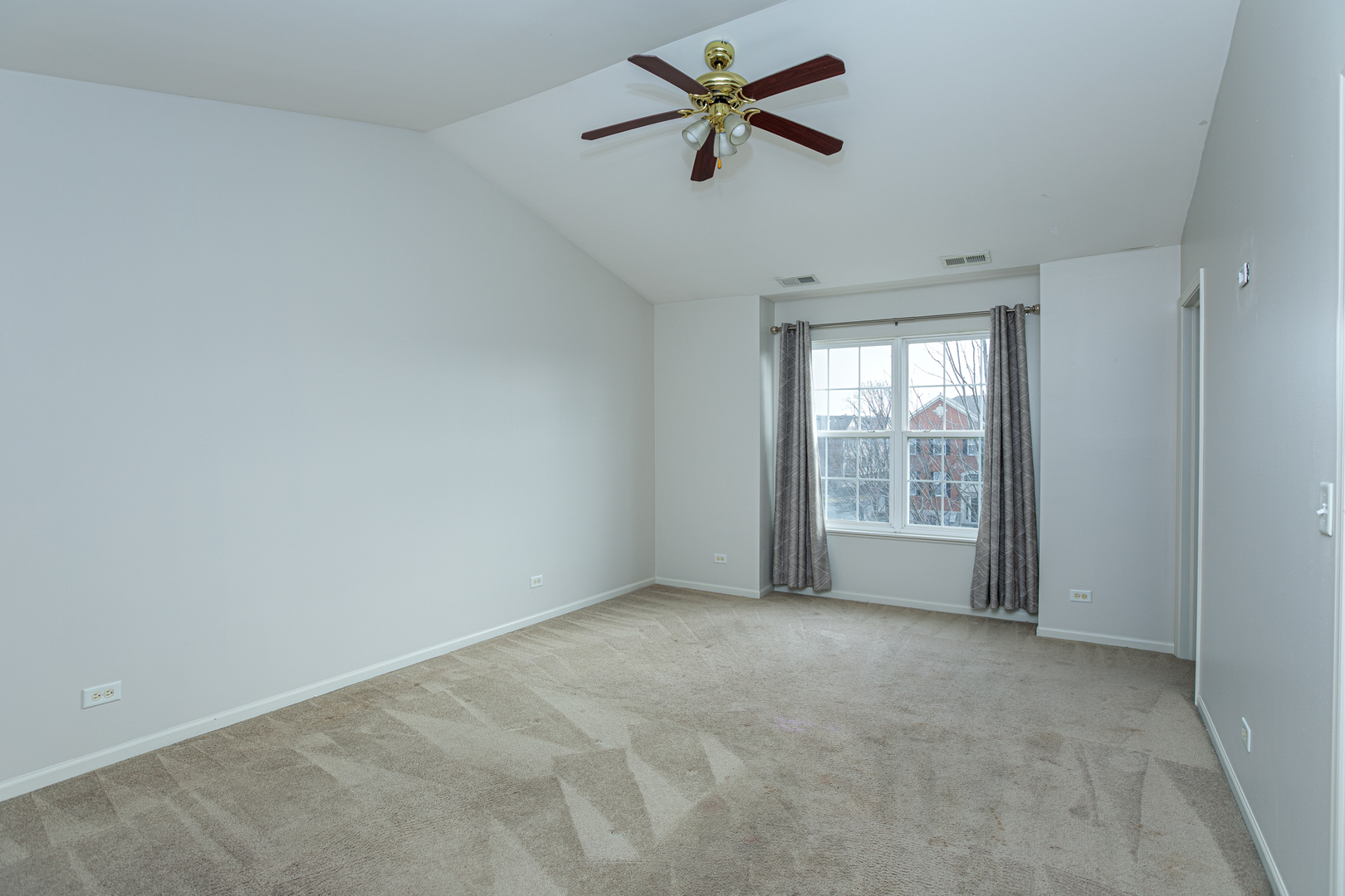 720 Thornbury Road Bartlett, IL 60103 - Photo 9 of 24 a view of room with a ceiling fan and window
