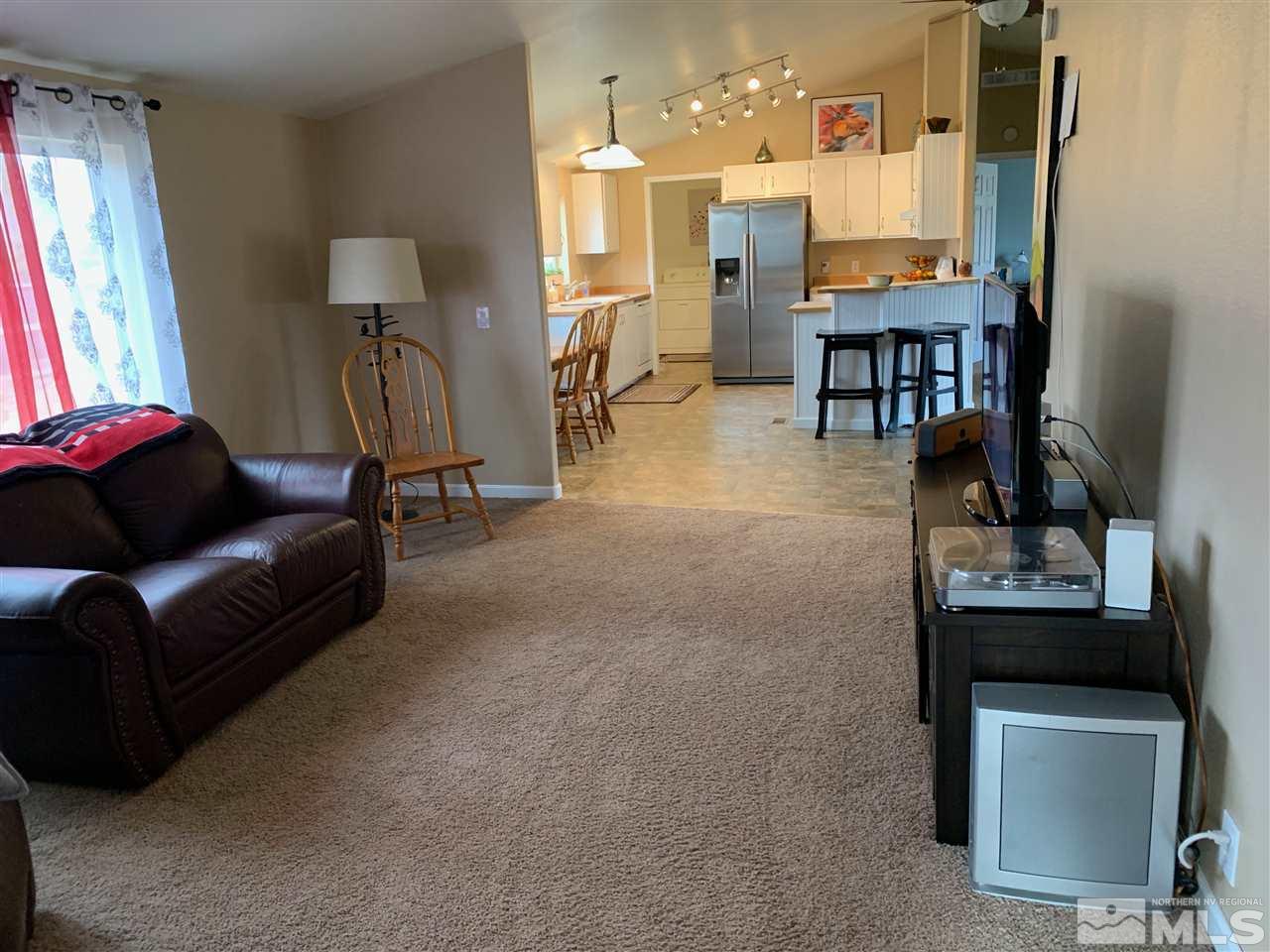 17385 Whippoorwill Lane Reno, NV 89508 - Photo 8 of 17 a living room with furniture and a table