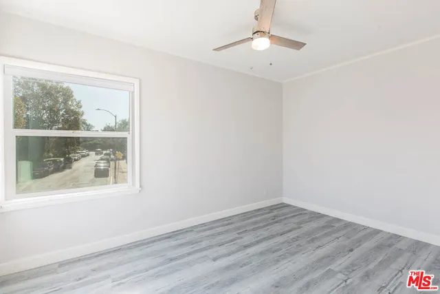 a bathroom with a toilet a sink a vanity and mirror