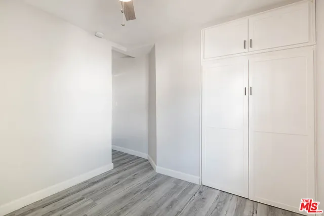 a view of white cabinets and sink