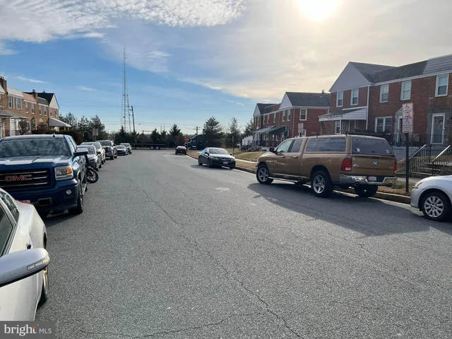 a view of street with parked cars