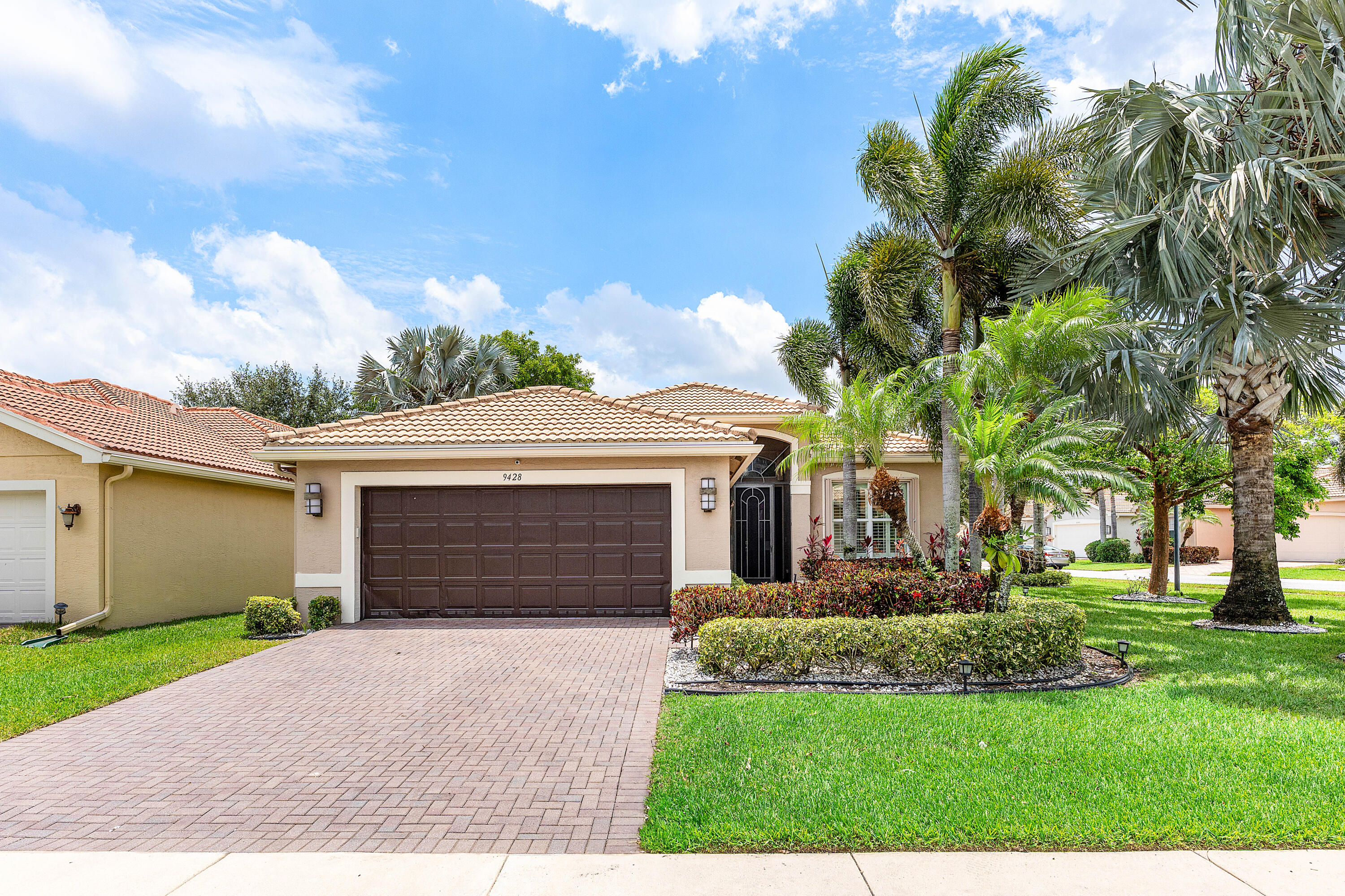 9428 Ivory Isle Road Boynton Beach, FL 33473 - Photo 1 of 46 Lushly Landscaped Exerior