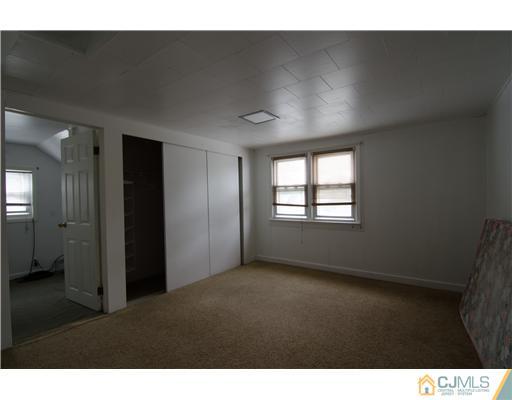 112 Idlewild Road Edison, NJ 08817 - Photo 16 of 20 a view of an empty room and window