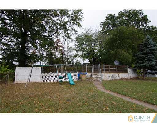112 Idlewild Road Edison, NJ 08817 - Photo 20 of 20 a view of a backyard with swings