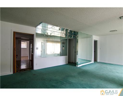 112 Idlewild Road Edison, NJ 08817 - Photo 3 of 20 a view of empty room with window