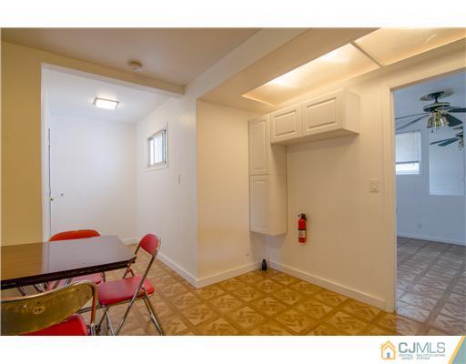 112 Idlewild Road Edison, NJ 08817 - Photo 5 of 20 a view of room with furniture and wooden floor