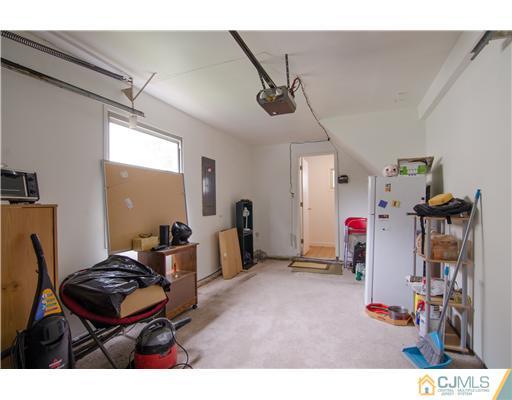 112 Idlewild Road Edison, NJ 08817 - Photo 6 of 20 a living room with furniture and a flat screen tv