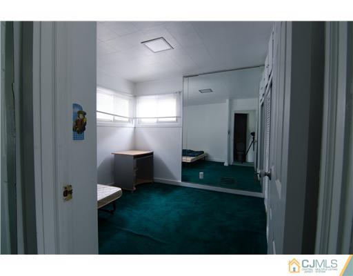 112 Idlewild Road Edison, NJ 08817 - Photo 9 of 20 a bathroom with a sink and a mirror
