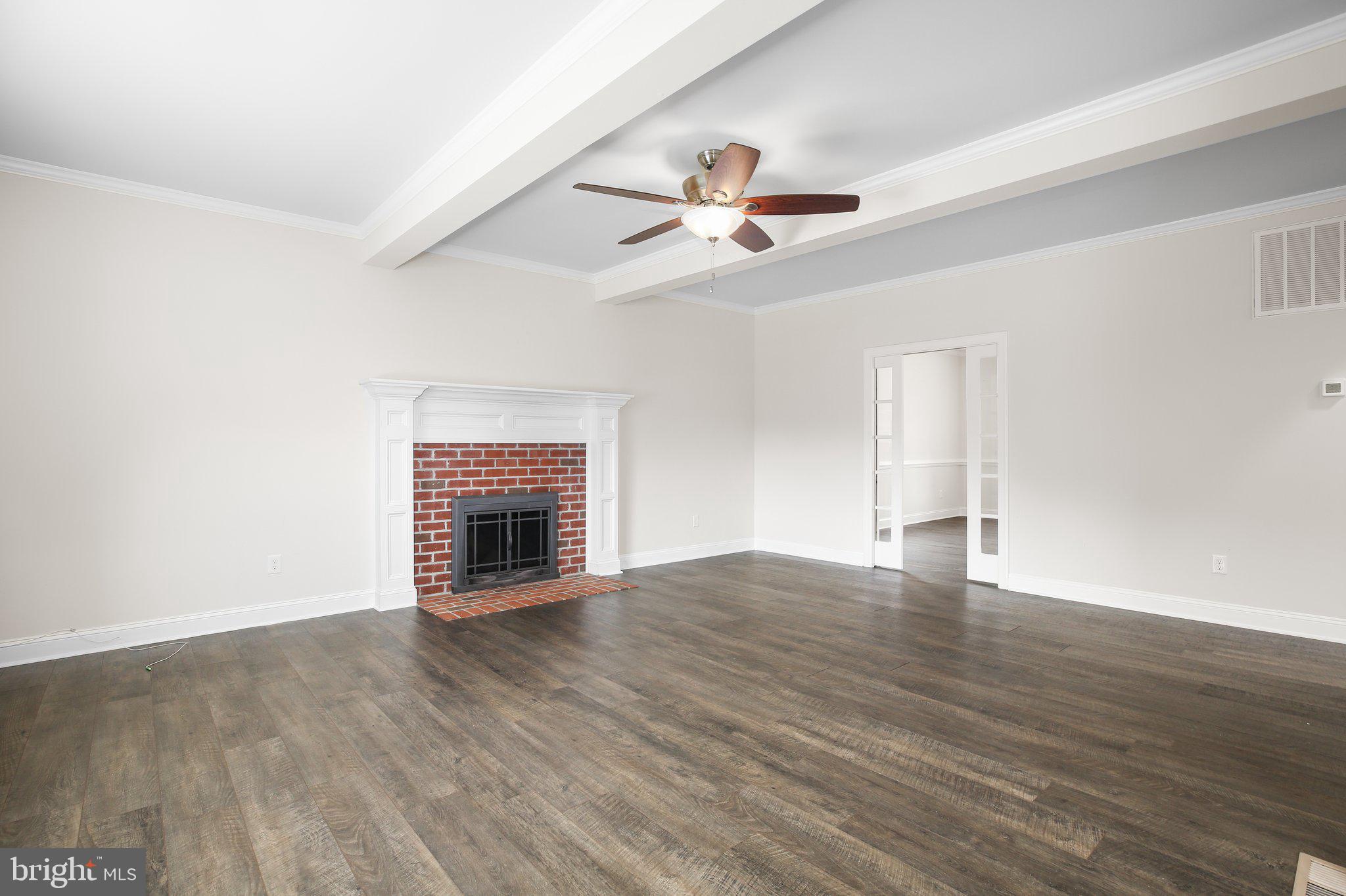 6337 Louisianna Road Locust Grove, VA 22508 - Photo 12 of 75 a view of empty room with wooden floor and fireplace