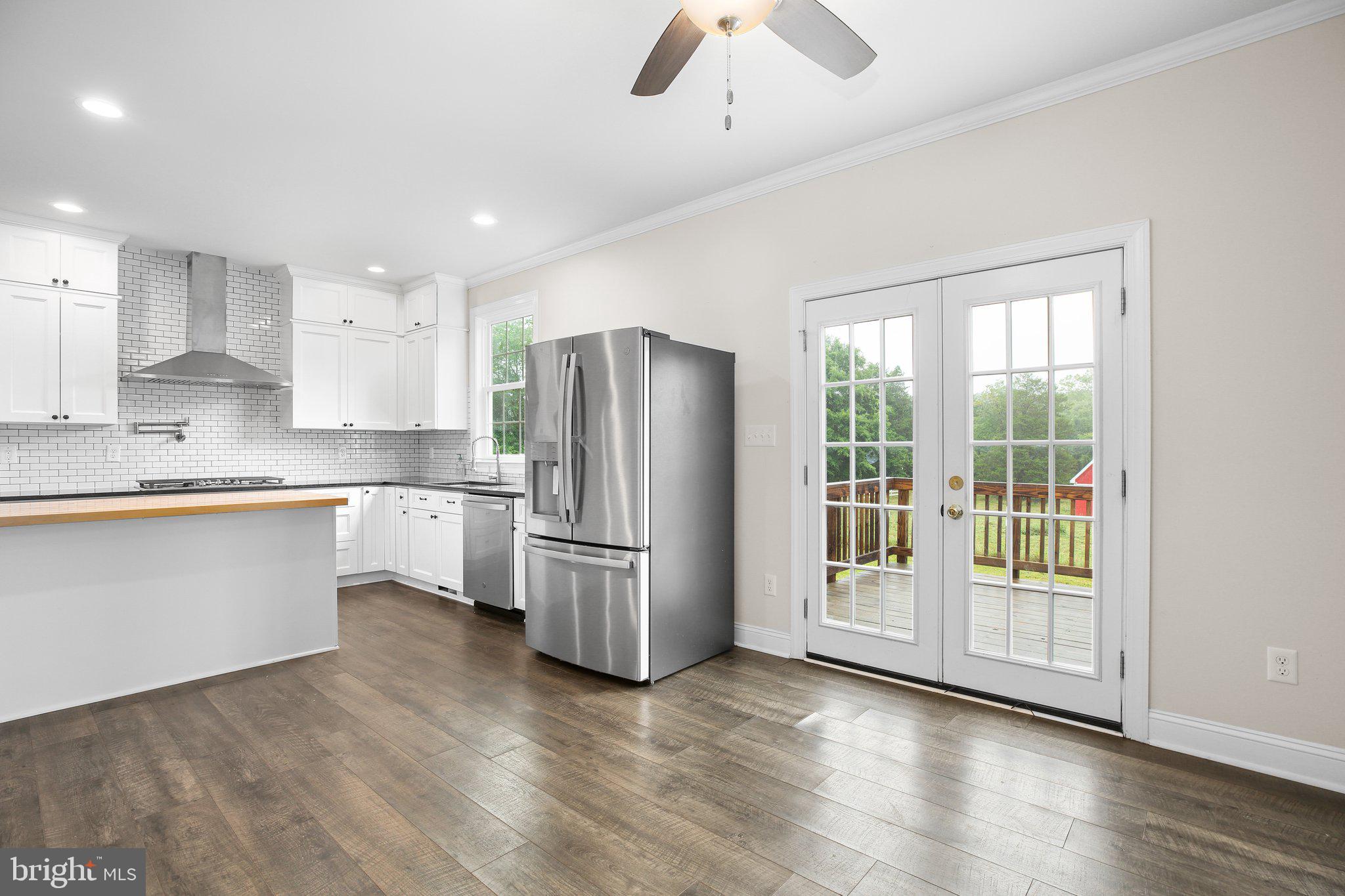 6337 Louisianna Road Locust Grove, VA 22508 - Photo 13 of 75 a kitchen with stainless steel appliances granite countertop a refrigerator and a stove