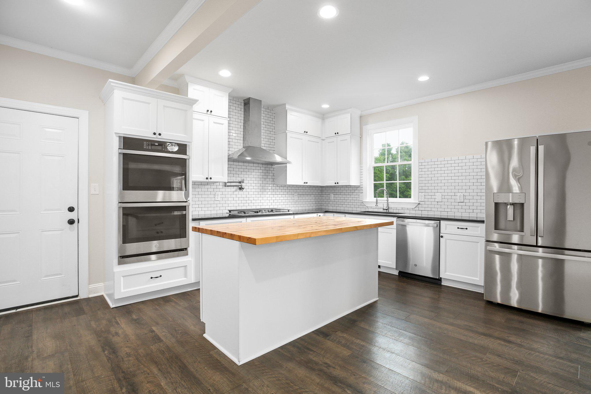 6337 Louisianna Road Locust Grove, VA 22508 - Photo 15 of 75 a large kitchen with stainless steel appliances and a refrigerator