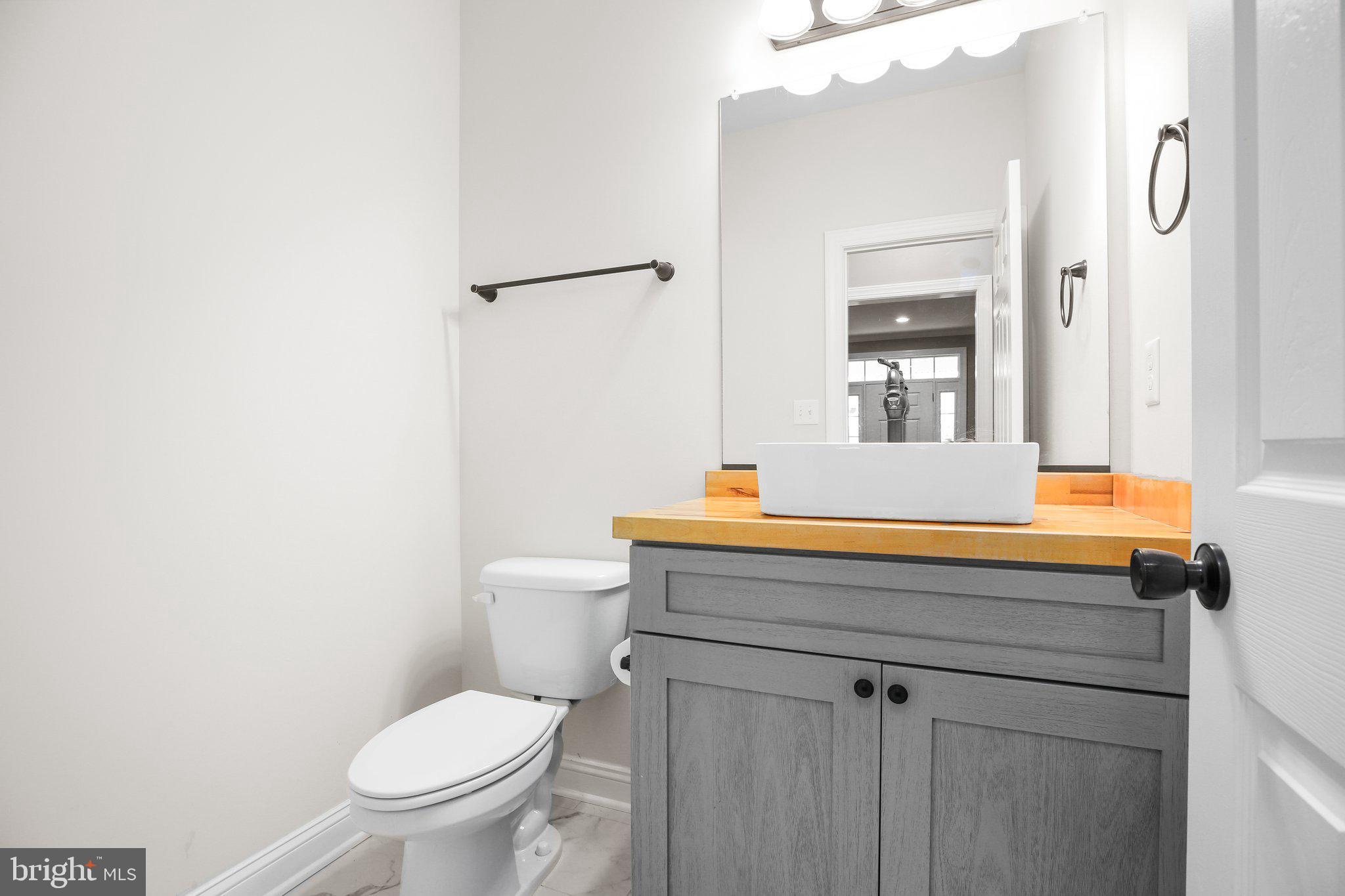 6337 Louisianna Road Locust Grove, VA 22508 - Photo 24 of 75 a bathroom with a granite countertop sink vanity mirror and toilet