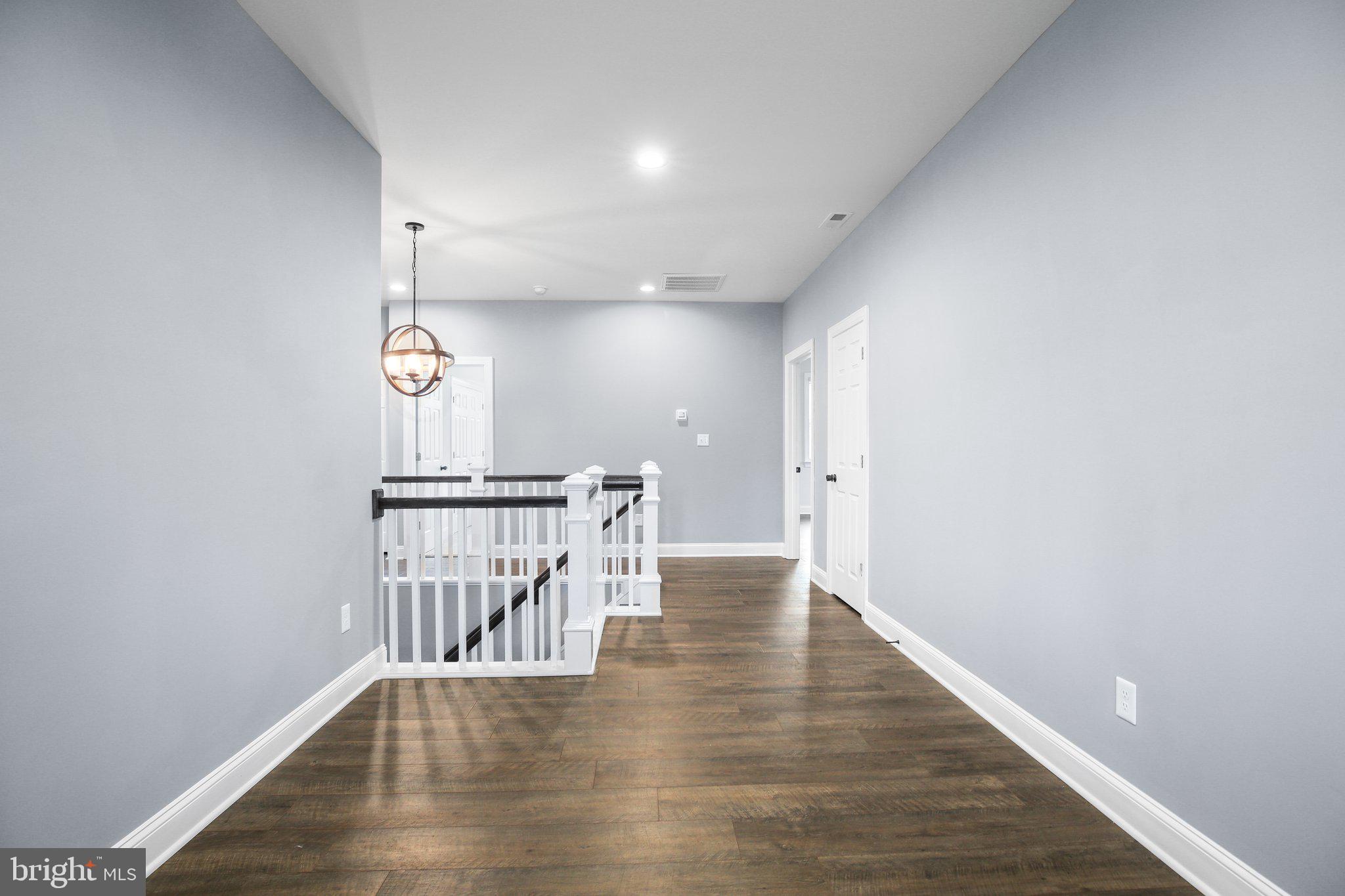 6337 Louisianna Road Locust Grove, VA 22508 - Photo 26 of 75 a view of a hallway with wooden floor