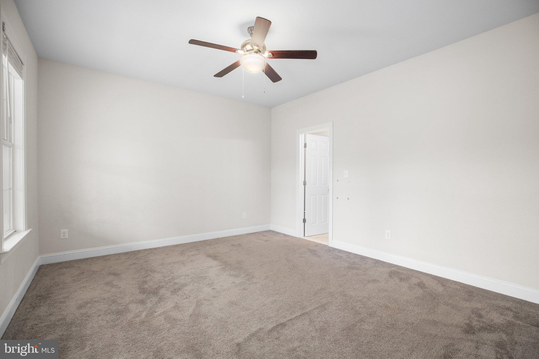 6337 Louisianna Road Locust Grove, VA 22508 - Photo 27 of 75 an empty room with ceiling fan and window