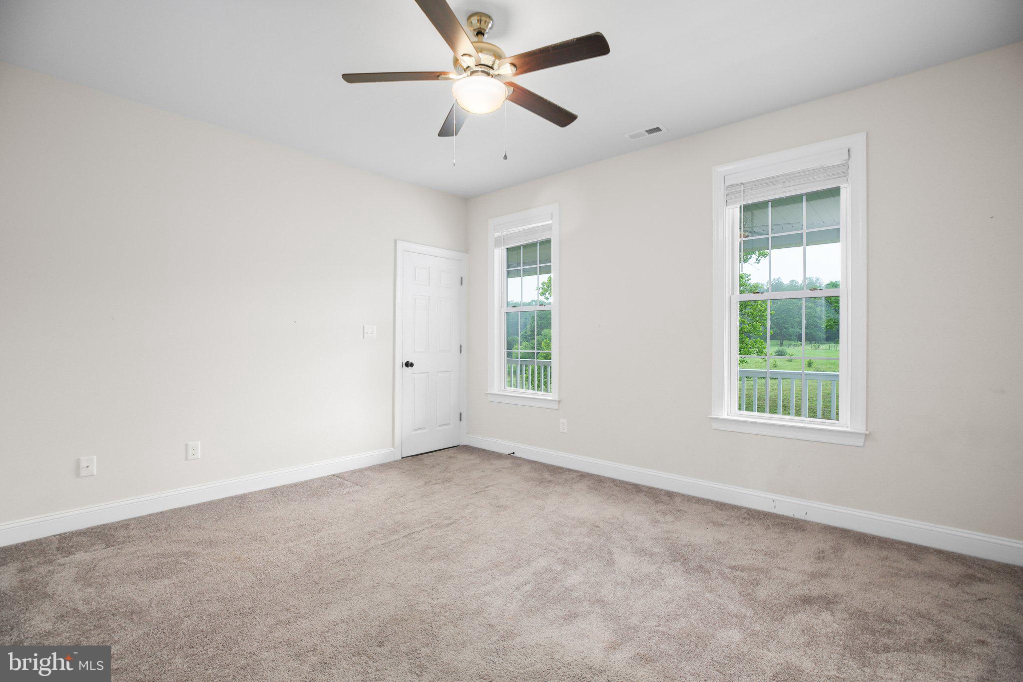 6337 Louisianna Road Locust Grove, VA 22508 - Photo 28 of 75 an empty room with windows and fan