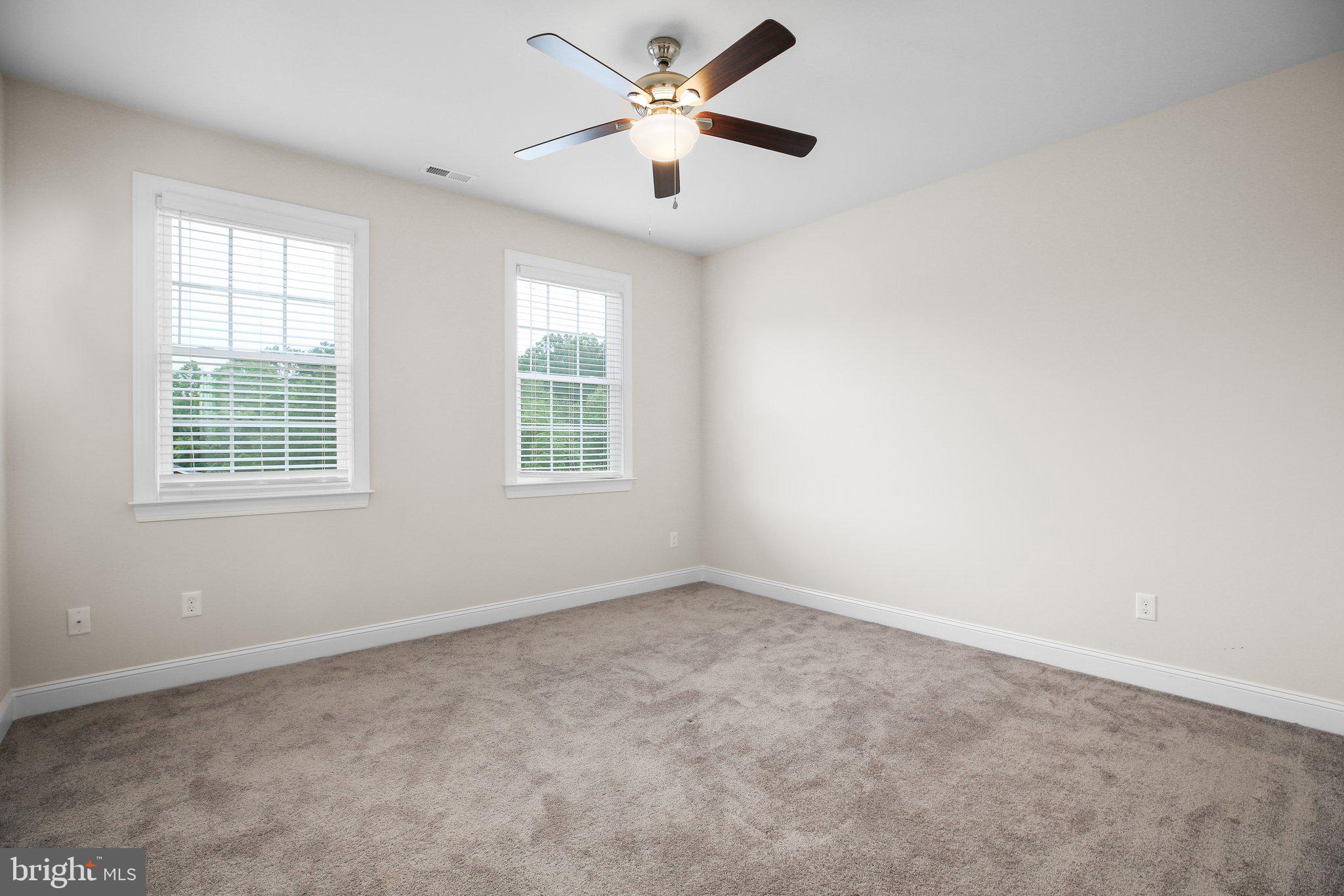 6337 Louisianna Road Locust Grove, VA 22508 - Photo 36 of 75 an empty room with windows and fan