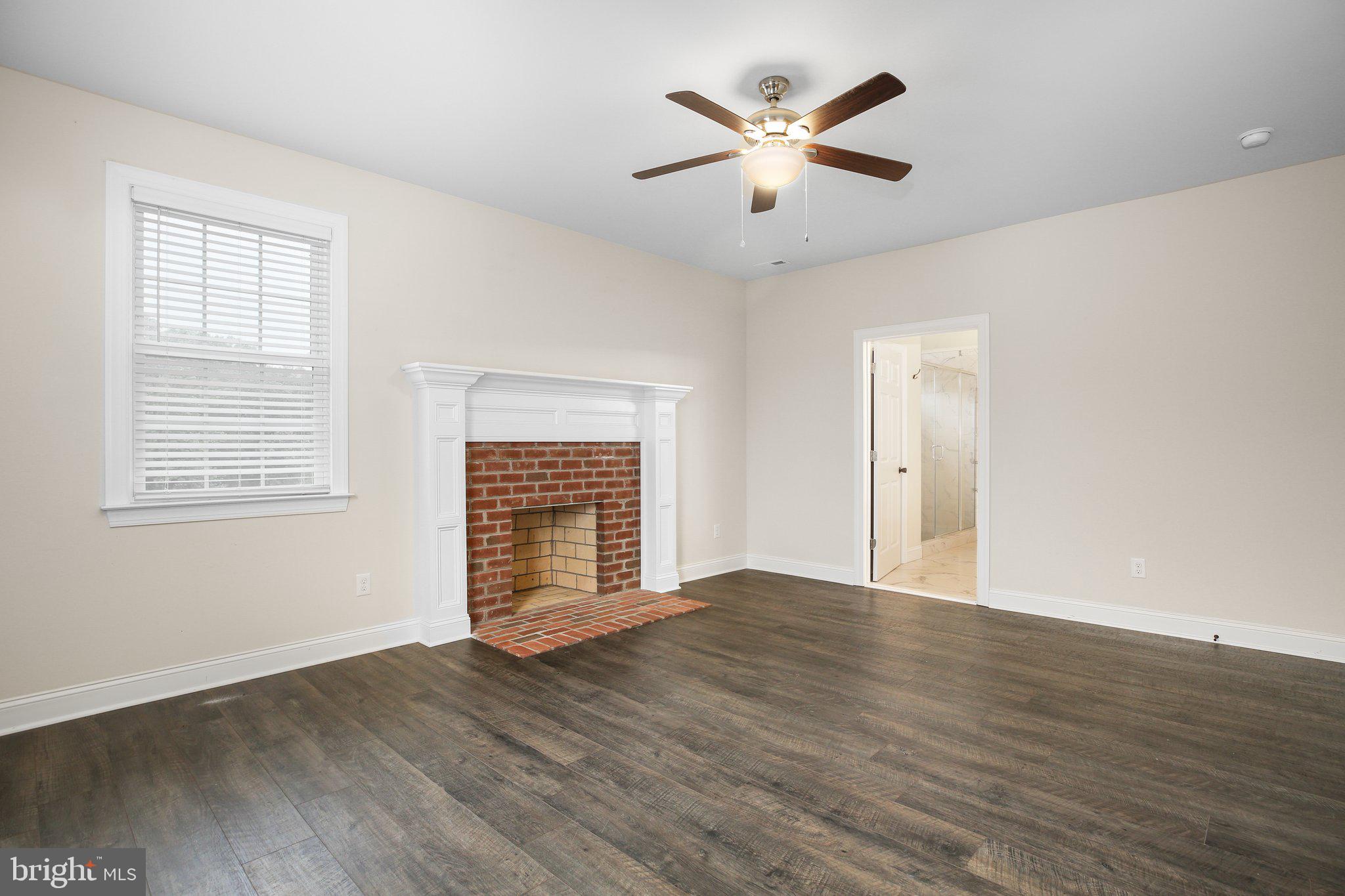 6337 Louisianna Road Locust Grove, VA 22508 - Photo 39 of 75 an empty room with wooden floor and windows