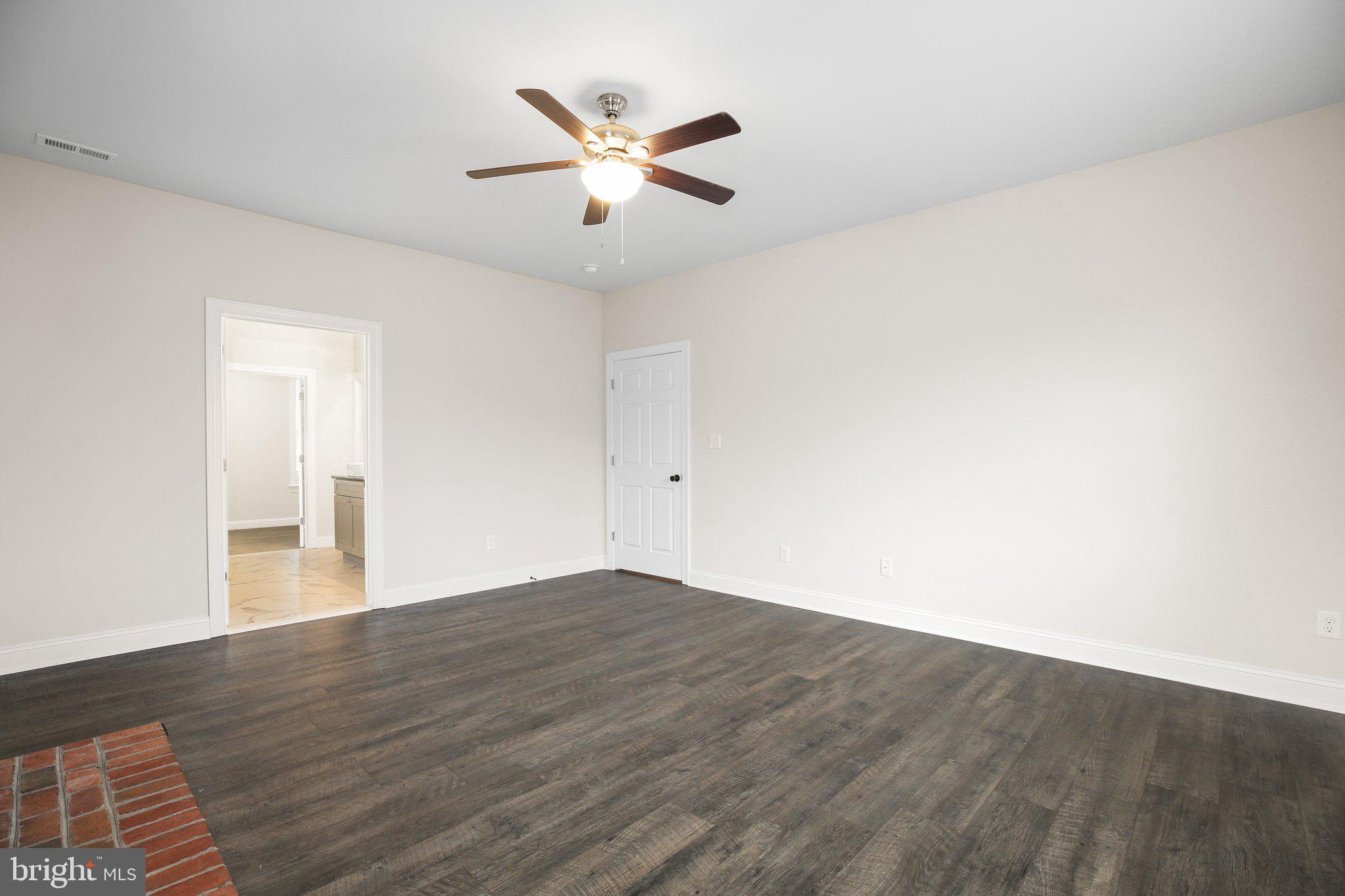 6337 Louisianna Road Locust Grove, VA 22508 - Photo 40 of 75 an empty room with wooden floor and ceiling fan