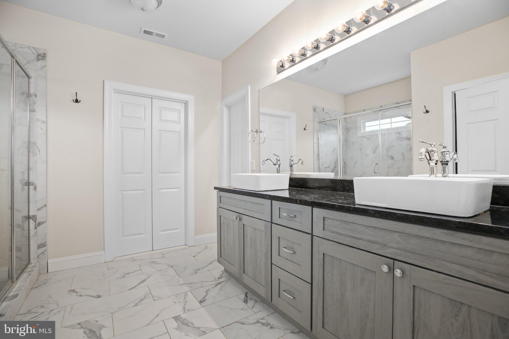 6337 Louisianna Road Locust Grove, VA 22508 - Photo 42 of 75 a bathroom with a sink and a mirror