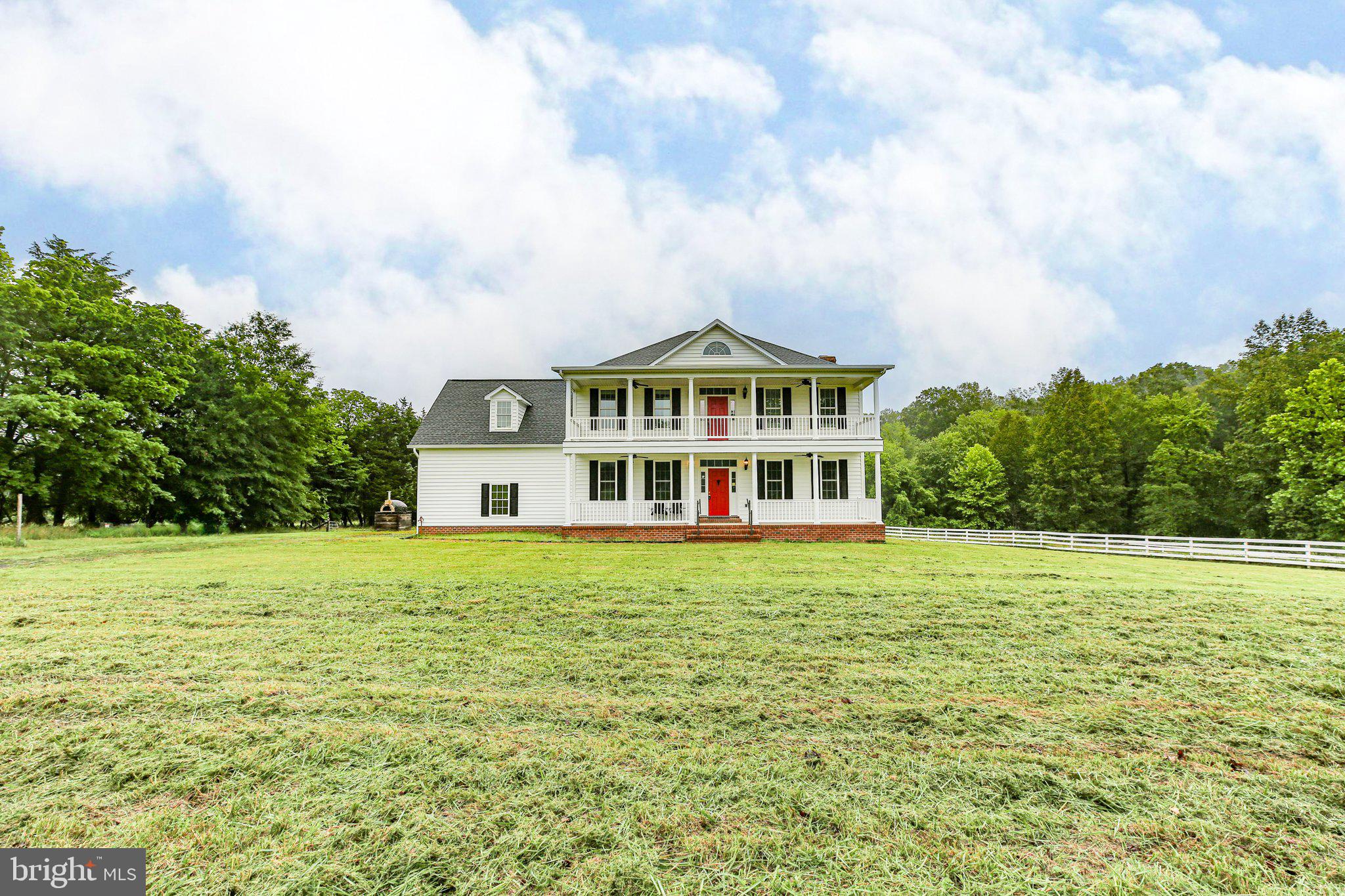 6337 Louisianna Road Locust Grove, VA 22508 - Photo 72 of 75 a view of a big house with a big yard and large trees