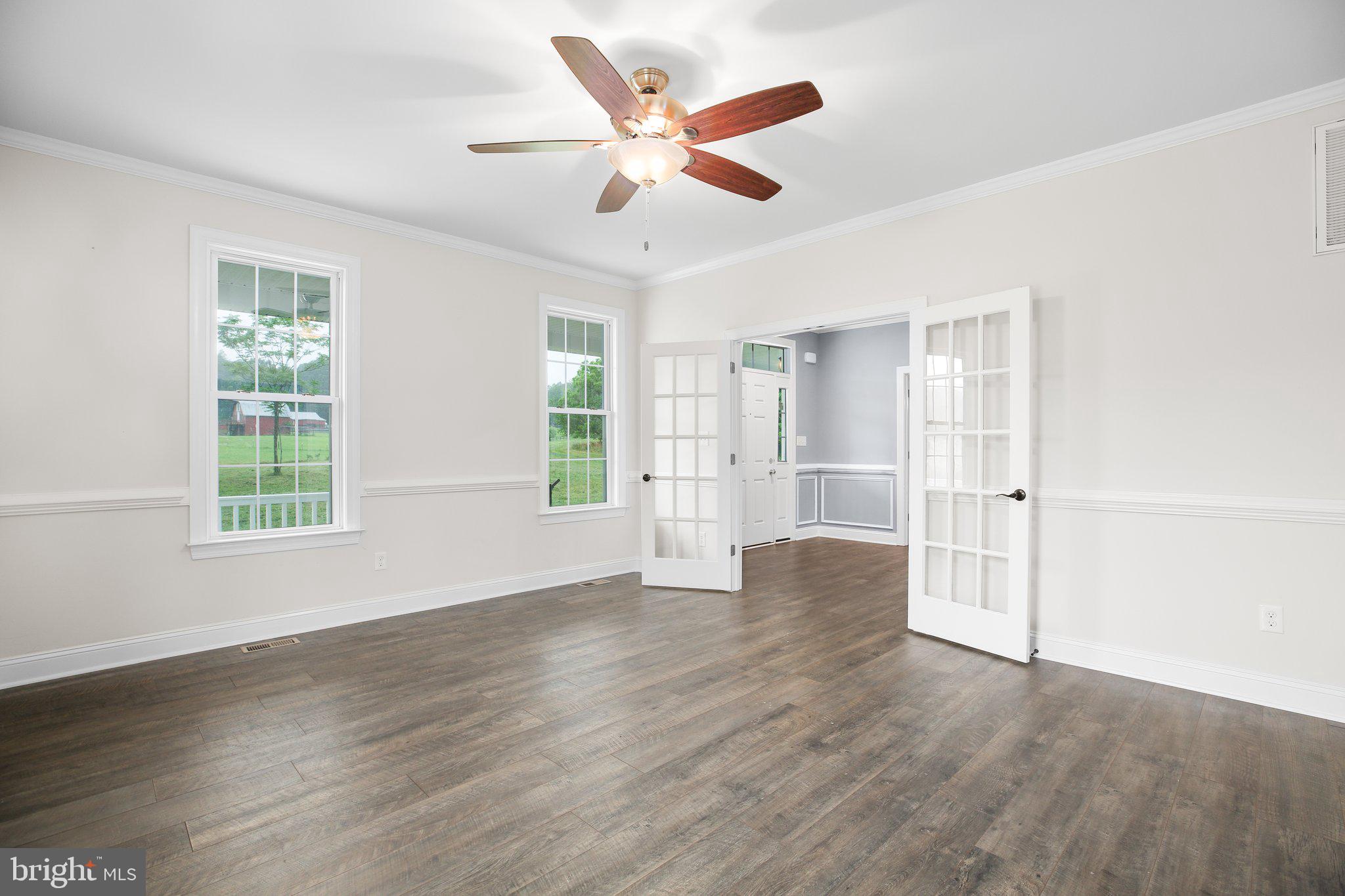 6337 Louisianna Road Locust Grove, VA 22508 - Photo 8 of 75 a view of an empty room with wooden floor and a window