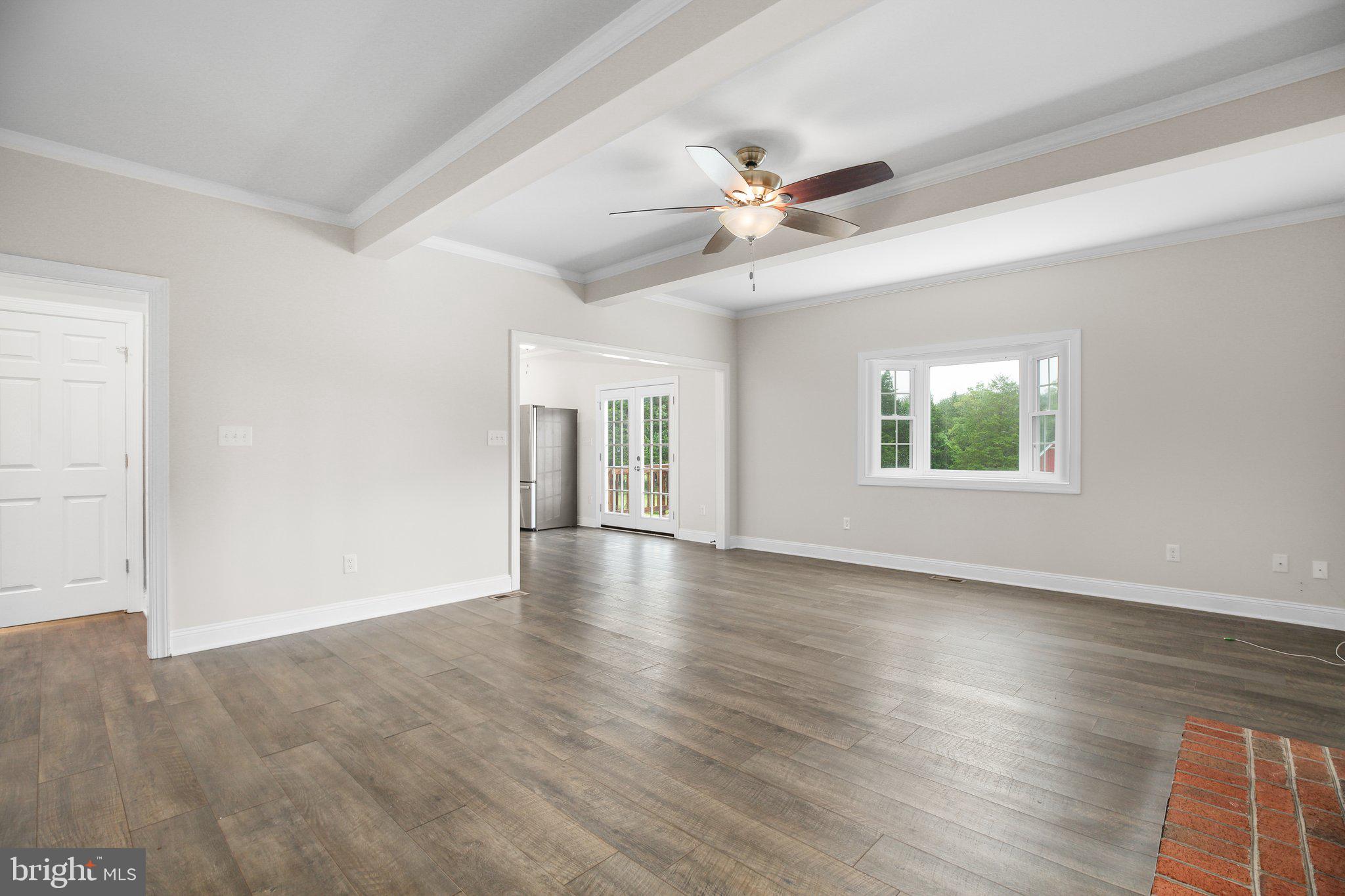 6337 Louisianna Road Locust Grove, VA 22508 - Photo 10 of 75 a view of an empty room with wooden floor and a window