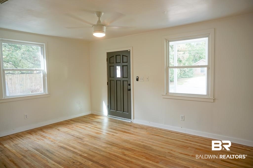 4667 Cottonwood Drive Mobile, AL 36608 - Photo 5 of 21 Unfurnished room with ceiling fan and light hardwood / wood-style floors