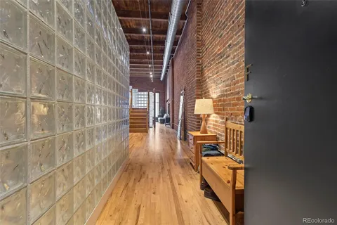 a view of balcony with wooden floor and door